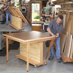 two men working on furniture in a shop