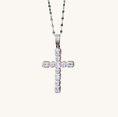 Introducing our stunning Vintage Silver Crystal Cross Necklace! Prepare to turn heads and capture attention with its mesmerizing sparkle and shine. This necklace is truly a showstopper that exudes elegance.The focal point of this necklace is its beautiful cross pendant, meticulously paved with high-quality cubic zirconia crystals. These crystals create a dazzling effect, catching the light from every angle and reflecting it in a mesmerizing display of brilliance. The intricate detailing of the c Elegant Rhinestone Cross Clavicle Necklace, Elegant Cross Necklace With Rhinestones, Elegant Cross Pendant Necklace With Bling, Elegant Necklace With Bling Cross Pendant, Elegant Rhinestone Cross Necklace On Clavicle Chain, Cubic Zirconia Cross Necklace With Clavicle Chain, Diamond White Cross Necklace, Diamond White Crystal Cross Necklace, Diamond White Cubic Zirconia Crucifix Necklace