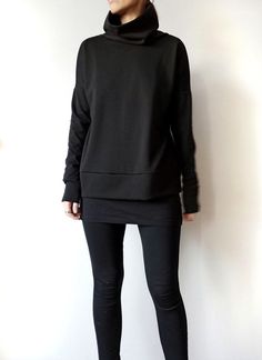 "Minimalist Black Women Sweater, Oversized Women's Heavier Jersey Top with High Collar, Loose Fitting Women Turtleneck Sweatshirt This minimalist black oversized top with a high turtleneck collar and extra long sleeves suits all types of figures. Fabric is a high-quality viscose lycra blend jersey, heavyweight that holds the geometrical shape well. It's a versatile style that can be dressed up or down for all occasions. With no zips, buttons or darts to deal with, this sweatshirt is a super quic Oversized Versatile Sweatshirt, Oversized Long Sleeve Minimalist Tops, Versatile Black Crew Neck Sweater, Black Boxy Fit Sweatshirt For Fall, Versatile Oversized Sweatshirt For Layering, Oversized Black Drop Shoulder Sweater, Versatile Oversized Black Tops, Winter Layering Tops With Drop Shoulder, Winter Layering Drop Shoulder Tops