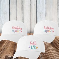 "These pretty pastel birthday hats are a fun choice for you and your birthday squad! Personalize your birthday hats with the design and custom text of your choice.  𝗗𝗘𝗦𝝞𝗚𝝢𝗦 * Hello  (enter any age/number) * Birthday Squad 𝗣𝗘𝗥𝗦𝗢𝗡𝗔𝗟𝗜𝗭𝗘 𝗜𝗧 * Optional: Add 1-2 lines of short custom text to the back 3.00 per hat)  (20 characters per line maximum) * Character limit includes spaces & punctuation * Personalized text comes in lettering style shown: ALL CAPS * No special characters or Birthday Cap With Letter Print, Fun Birthday Party Hat Supplies, Adjustable Curved Brim Hat For Birthdays, Curved Brim Baseball Cap For Birthday, Customizable Pink Birthday Hat, Birthday Trucker Hat With Letter Print, Fun Pink Birthday Hat, Fun Letter Print Trucker Hat For Birthdays, White Letter Print Hat For Birthday