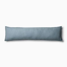 a blue pillow on a white background