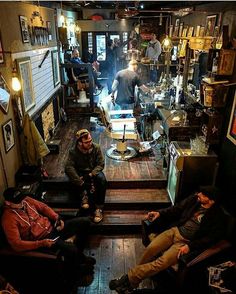 a group of people sitting around in a room