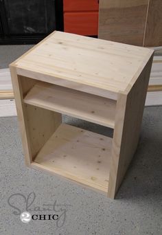 a wooden shelf sitting on top of a floor