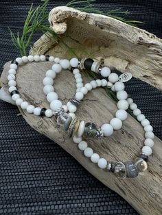 Embrace the calm elegance of the Timeless Serenity Bracelet Set by JP Designs. This handcrafted set combines Matte Ivory Jade beads with uniquely textured Recycled Glass and stunning Lampwork Beads. The addition of Crystal Quartz and luminous Cornflake Pearls creates a perfect harmony of rustic charm and refined elegance. Silver accents add a touch of sophistication, making this set a versatile choice for any style. Perfect for layering or wearing individually, these bracelets offer an effortles Elegant Hand-strung Crystal Bracelet For Meditation, Elegant Crystal Bracelet For Meditation, White Elegant Beaded Bracelets With Gemstone Beads, Elegant Beaded Agate Crystal Bracelet, Elegant Beaded Crystal Bracelet For Meditation, Elegant Handmade Crystal Bracelet For Meditation, White Elegant Crystal Bracelet With Natural Stones, Elegant White Crystal Bracelet With Natural Stones, Elegant White Agate Crystal Bracelet