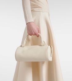 Edith leather shoulder bag in white - The Row | Mytheresa Formal Beige Calf Leather Satchel, Cream Evening Shoulder Bag, Timeless Beige Shoulder Bag With Handle Drop, Timeless Cream Satchel For Formal Use, Beige Calf Leather Satchel With Top Carry Handle, Beige Calf Leather Satchel With Top Handle, Beige Calf Leather Top Handle Shoulder Bag, Luxury Cream Satchel Shoulder Bag, Beige Calf Leather Evening Bag