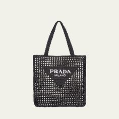 Prada tote bag in woven raffia with calf leather trim. Flat top handles. Open top. Exterior, contrast logo at front. Made in Italy. Designer Rectangular Crochet Bag With Handles, Designer Crochet Rectangular Bag With Handles, Designer Rectangular Crochet Bag, Designer Black Rectangular Straw Bag, Designer Rectangular Crochet Shopping Bag, Designer Black Straw Bag For Daily Use, Designer Black Straw Bag With Top Handle, Top Handle Straw Bag With Dust Bag For Shopping, Designer Straw Bag For Shopping With Top Carry Handle