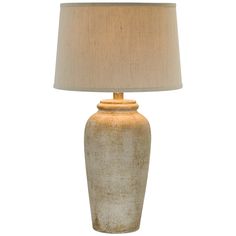 a table lamp with a beige shade on it and a white linen lampshade