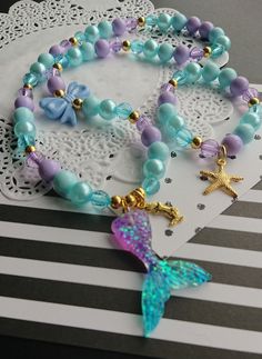 "Mermaid inspired necklace bracelet set, kids beaded set, jewelry set, childrens jewelry, starfish bracelet, kids necklace, party favor. \"Mermaid Kisses and Starfish Wishes\" DETAILS and MEASUREMENT: Necklace: 20\" Bracelet: 6.5\" Made on stretchy cord. We can also put a clasp on it, for an extra $3.50 PLEASE NOTE: due to the high volume of orders, it is impossible for us to keep the same beads for all our orders, so the beads on your order may differ from the ones shown in the photo. if you wo Mermaid Bracelet Diy, Little Mermaid Bracelet, Big Sister Necklace, Blue Snacks, Festival Clothes, Mermaid Crafts, Mermaid Kisses, Starfish Bracelet, Mermaid Bracelet