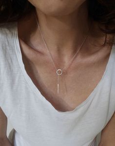 This Lariat necklace is totally handmade made from sterling silver. A dainty necklace that adjusts to any outfit. Great layering charm necklace, easy to wear on its own too. The diameter of the circle is 12 mm and the bar is 20 mm long. Length: 52 cm -----> 20 inches 62 cm -----> 24 inches 72 cm -----> 28 inches Feel free to ask for a different length. The necklace above is not the exact one you will receive. Each one is handmade to order and may slightly vary from the pictures. Please Sterling Silver Clavicle Chain Lariat Necklace For Everyday, Sterling Silver Lariat Necklace For Everyday, Everyday Sterling Silver Lariat Necklace With Clavicle Chain, Everyday Sterling Silver Lariat Necklace, Silver Minimalist Lariat Necklace With Delicate Chain, Minimalist Lariat Necklace With Round Pendant, Sterling Silver Long Drop Lariat Necklace As Gift, Sterling Silver Lariat Necklace With Long Drop For Gift, Minimalist Sterling Silver Lariat Necklace With Clavicle Chain