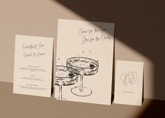 three greeting cards with wine glasses on them