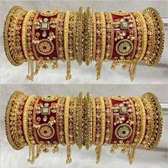 two rows of gold colored bangles with different designs and colors on each bracelets