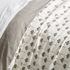 the bedding is made up with black and white designs