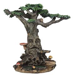 a figurine of a tree with mushrooms on it