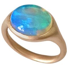 Dalben design One of a kind 18 kt rose gold matte finishing ring with a 4,32 carat bezel-set oval deep light blue lovely Australian Opal . Ring size 7 1/4 - EU 55 re-sizable to most finger sizes. Bezel setting dimension: max width 15 mm, max height 11,4 mm. The ring has been designed and handcrafted in our atelier in Italy Como with a rigorous quality workmanship . Round Opal Ring, Opal Rose Gold Ring, Italy Como, Opal Ring Vintage, Rose Gold Opal Ring, Jewelry Wishlist, Australian Opal Ring, Opal Diamond Ring, Ring Inspiration