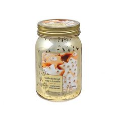 a glass jar filled with an orange and white cat design on the inside of it