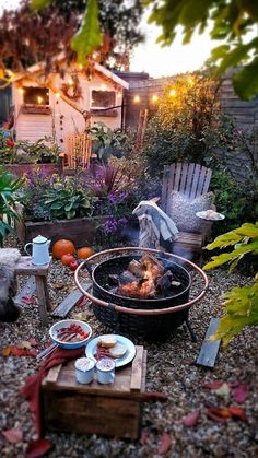 an outdoor fire pit with food on it