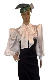 PRODUCT DETAILS  - Semi- fitted blouse. - Satin top with oversized spread collar. - Long ( 25 inch - 63.5 cm Long without cuffs) puffy sleeves gathered at shoulder and cuff sleeves.  -  Button- fastening cuffs - 3.5 inch/9 cm wide ( with 2 satin covered buttons for each cuff) - Centre-front button fastening with satin covered buttons. - Self Neck Tie 6 inches/ 15 cm wide and 67 inch/ 170 cm long  - Shirt Length, measured from shoulder height to hem - 27 inch ( 68cm). - Shirttail hem. - Fabric- Satin Polyeste. Machine wash. Line dry.   Only basic body measurements are needed to your pattern type and size. Remember to wear proper undergarments and shoes when measuring. Also, make sure the tape measure is held snugly and firmly (not tightly) against your body and is always parallel to the flo Classic Fitted Padded Blouse, Elegant Formal Top With Collar, Elegant Fitted Blouse For Formal Events, Elegant Fitted Top Blouse For Formal Occasions, Padded Fitted Blouse For Evening, Classic Fitted Shirt With Puff Sleeves, Elegant Long Sleeve Stretch Blouse, Elegant Stretch Tops For Office, Fitted Padded Blouse For Evening