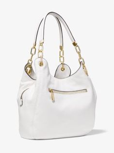 Our Lillie shoulder bag combines timeless glamour with everyday functionality. Designed in a slouchy shape and detailed with our signature hardware this carryall features a pebbled-leather exterior that opens to reveal two snap compartments and a secure center zip pocket. Count on it to tote your essentials with stylish ease. Modern White Pebbled Leather Bag, White Pebbled Leather Shoulder Bag For Travel, Luxury Shoulder Bag With Pebbled Texture For Daily Use, Luxury Formal Bags With Pebbled Texture, Michael Kors Travel Bags In Pebbled Leather, Michael Kors Pebbled Leather Bag For Everyday Use, White Pebbled Leather Shoulder Bag, Michael Kors Pebbled Leather Travel Bag, Formal Satchel With Pebbled Texture