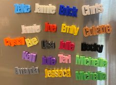 colorful magnets that spell out the names of different cities on a refrigerator door in a kitchen