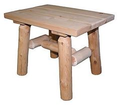 a small wooden table with logs on it