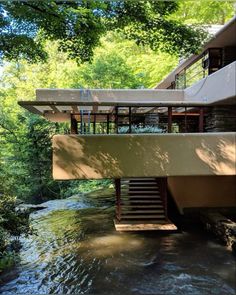 a house that is sitting on the side of a river