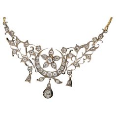 An elegant historical necklace decorated with 41 old brilliant-cut diamonds with a total weight of 1.80ct and a central diamond weighing 0.45ct. Diamonds of SI-P purity and H-K color. Historical motif with crescent and stars. Necklace made of 580 gold and silver elements. Origin: 1900s. The chain was replaced with a new one in the mid-20th century. The purchase includes a certificate Product weight: 17.60g. Historical Necklace, Lisa Minci, Antique Gold Necklace, Cabin Door, Stars Necklace, Historical Jewellery, Art Nouveau Style, Jewel Box, Gorgeous Jewelry