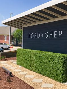 the ford and shep sign is shown in front of a building with cars parked outside