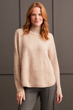 We're falling hard for this mock neck sweater this season, and you'll instantly see (and feel) why. We can't get enough of the pop-over design, long sleeves with drop shoulders, high-low hem, and the textured fabric showcasing an elegant diamond pattern that adds a soft and stylish finish. Style: 1528O-3590-0052 Beige Turtleneck Sweater For Fall, Cream Turtleneck Sweater For Fall, Cream Turtleneck For Fall, Beige High Neck Sweater For Fall, Beige Turtleneck Sweater With Textured Knit, Beige Textured Knit Turtleneck Sweater, Beige Turtleneck Sweater For Layering, Cream Turtleneck Top For Fall, Beige Textured Knit Long Sleeve Turtleneck