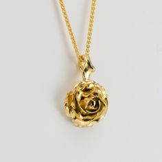 Flower Necklace, Gold Rose Necklace, Confirmation Gift A truly romantic gift! handcrafted solid gold rose necklace. The pendant features a beautiful rose suspended by delicate thorns. * Material: 9ct Fairtrade / recycle UK hallmarked gold * Size of Rose: Approx 1 cm (0.4in) diameter * Length of Chain: 1 mm Spiga chain 40 cm (16in) long (it could be longer on request ) * Ready to Ship in 10 business day * Made in the United Kingdom PACKAGING: Comes uniquely packaged in my Magnolia Restrepo Style Yellow Gold Flower-shaped Jewelry With Rose Design, Yellow Gold Jewelry With Rose Design In Flower Shape, Delicate Gold Jewelry With Roses, Gold Floral Jewelry With Rose Details, Yellow Gold Rose Pendant Jewelry, Gold Jewelry With Rose Flower Pendant, Gold Rose Jewelry For Anniversary, Gold Roses Jewelry For Anniversary, Gold Jewelry With Rose Details As Flower Pendant