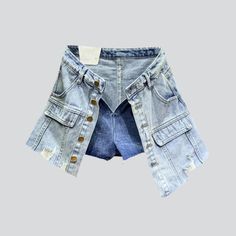 Introducing the 2023 Summer Collection's distressed hem buttoned denim skort. a grunge-inspired masterpiece perfect for the modern fashionista!Why You'll Fall In LoveThis skort is a unique combination of vintage-inspired grunge and urban flair. tailored to fit comfortably and stylishly. Its mid-waist rise. distressed hem. and buttoned closure all come together to create a timeless look that will take you from day to night with ease.Unmissable Highlights: Grunge-Inspired: Tap into the grungy vibe Trendy Cutoff Denim Skirt With Built-in Shorts, Trendy Cutoff Jean Shorts With Pockets, Trendy Button-up Shorts For Spring, Trendy Cutoff Denim Skirt With Pockets, Trendy Buttoned Shorts For Spring, Trendy Spring Button-up Shorts, Trendy Spring Shorts With Buttons, Trendy Button-up Denim Blue Bottoms, Trendy Button-up Denim Bottoms