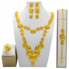 Indulge in luxury with this exquisite Dubai Gold Necklace Set, perfect for wedding parties. With its opulent design and superior craftsmanship, this set features a necklace, bracelet, earrings, and ring. Make a lasting impression and elevate your style with this luxurious jewelry set.' Plated Alloy Jewelry Sets For Gifts, Elegant Alloy Jewelry For Party, Elegant Party Jewelry In Alloy, Elegant Party Jewelry Made Of Alloy, Elegant Formal Alloy Necklace, Plated Alloy Costume Jewelry, Elegant Cubic Zirconia Party Sets, Elegant Alloy Jewelry Sets For Gifts, Silver Plated Bridal Sets As Gift