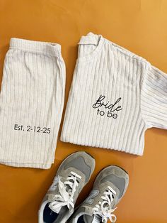 Celebrate your special day in style with our personalized Bride PJ Set! Perfect for the future Mrs., this charming pajama set is ideal for bridal parties and pre-wedding festivities. Customize it with your name or wedding date for a unique touch that makes it truly yours. Crafted from soft, breathable fabric, these pajamas ensure comfort as you celebrate with your bridesmaids. A thoughtful gift for the bride-to-be, this keepsake pajama set will be cherished long after the big day. Whether lounging at home or getting ready for the ceremony, you'll look fabulous and feel fabulous too. Make your wedding memories even more special with this delightful bridal party essential! Tunic Short Sleeve Shirt with elastic waist shorts. Loose top and Fitted shorts. made of polyester SIZE  Small  31"-33" Wedding Day Bride, Fitted Shorts, Wedding Festivities, Personalized Pajamas, Bridal Parties, Personalized Bride, Future Mrs, Loose Top, Bride Gift