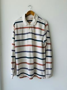 Vintage Brooks Brothers Long Sleeve Striped Polo Shirt Crest Logo Size Large  Good vintage condition  100% cotton Authentic  See all photos for measurements Casual Cotton Tops With Striped Collar, Classic Multicolor Long Sleeve Tops, Vintage White Tops With Striped Collar, Vintage White Top With Striped Collar, White Tops With Striped Collar For Fall, Relaxed Fit Cotton Tops With Striped Collar, Relaxed Fit Cotton Top With Striped Collar, White Tops With Striped Collar And Relaxed Fit, Multicolor Cotton Polo Collar Top