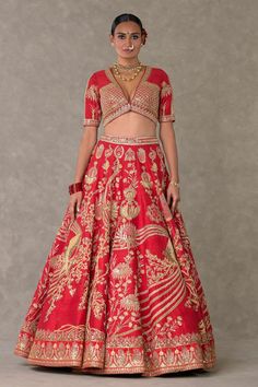 Red lehenga with separate cancan skirt, adorned with Son-chidiya, Haath-phool, Neel-Kamal, Shajara motifs in dori, multicolor thread, sitara, moti kaam work and hemline embellished with embroidered haathphool border and edged with kinari. Paired with embroidered padded blouse and brocade woven dupatta in Haathphool border and anar buti all over.
Components: 4
Pattern: Embellished, Embroidery
Type Of Work: Dori, thread, sitara, moti
Neckline: V neck
Sleeve Type: Half sleeves
Fabric: Lehenga and B Can Can Skirt, Cancan Skirt, Embellished Embroidery, Haath Phool, Caribbean Fashion, Raw Silk Lehenga, Padded Blouse, Red Lehenga, Lehenga Blouse