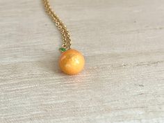 This dainty orange / tangerine necklace is made of the following: (1) Gold plated orange slice charm (charm size: 12 x 8.5mm) (2) Gold plated or 14KGF chain and findings ✏️ Please choose the length of the chain (the length includes clasp and findings) ✏️ Please choose your desired plating of chain ❣️ If you are unsure about which length to choose , please leave me a note to request an extension chain to be added to the chain at check out. 🍊EARRINGS 🍊 Threader -> https://www.etsy.com/listing Orange Pendant Charm Necklaces For Gifts, Orange Dainty Jewelry For Gifts, Dainty Orange Jewelry For Gifts, Dainty Orange Jewelry For Gift, Orange Round Necklace For Gifts, Handmade Orange Charm Necklace As A Gift, Handmade Orange Charm Necklace For Gift, Adjustable Orange Necklace For Gifts, Peach Necklace Gift