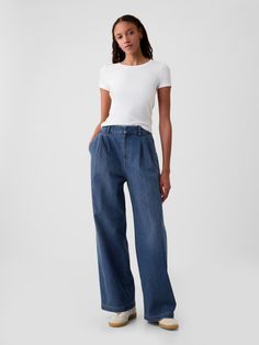 Soft structured denim trousers.  E-waist with concealed hook and bar closure, zip fly.  Front slant pockets, back welt pockets.  Pleating at front.  Responsibly Made: This denim trousers is part of our water-saving Washwell program.  Compared with conventional wash methods, Washwell uses at least 20% less water and has saved over a billion liters of water since 2016.  Responsibly Made: Made with 6% recycled cotton.  Using recycled materials helps to conserve resources and reduce waste.  * Fit: Classic.  An easy silhouette that fits close  at the waist, and is relaxed through the hips and thigh.  Models wearing Gap High Waisted Wide Leg Jeans, Azul Indigo, Future Style, High Rise Denim, Denim Trousers, Fashion Studio, Trouser Jeans, Spring Summer Outfits, Recycled Cotton