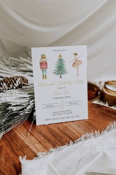 a white card with an image of a nutcracker and a christmas tree on it