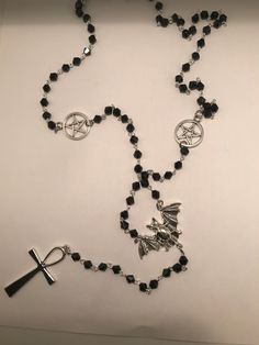 Inspired by vampires.  this rosary has faceted glass beads, pentagrams, bat and ankh.  perfect for the darkling in your life or treat yourself.  Long enough to suit many different body types and sizes.  To make shorter just make a revolution around your neck with the rosary and the pentagrams will lay flat and still be visible.  Will present in organza gift bag, please ask any questions :) Gothic Black Beads Jewelry For Halloween, Gothic Black Beads Halloween Jewelry, Gothic Cross Necklace For Festivals, Goth Rosary, Gothic Rosary, Rosary Style Necklace, Mushroom Ring, The Darkling, Goth Jewelry