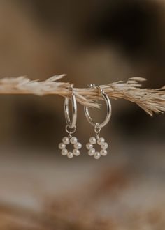 hanging set of pearl hoop earrings charms Sterling Silver Flower Earrings With Pearl Drop, Pearl Flower Earrings With Flower Charm, Silver Flower Pearl Earrings With Flower Charm, Delicate Pearl Earrings With Flower Charm, Silver Wire Wrapped Flower Jewelry, Pearl Flower Charm Earrings, Delicate Pearl Charm Flower Earrings, Delicate Hoop Jewelry With Flower Charm, Small Hoop Pearl Pendant Jewelry For Gift