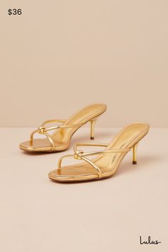 The Lulus Victoire Gold Knotted Strappy High Heel Slide Sandals are here to complete all your simply stunning date night looks! These strut-worthy sandals have a shiny faux leather construction that shapes an open-toe upper and an almond-shaped footbed. Crisscrossing straps boast a knotted detail atop the slide-on silhouette that sits atop a flirty stiletto heel. 2. 75" wrapped stiletto heel. Cushioned insole. Rubber sole has nonskid markings. Man made materials. Imported. Lulus | Victoire Gold Hoco Sandals, Gold Sandals Outfit, Vacation Heels, Hoco Heels, Vacay Fits, Gold Kitten Heels, Bridesmaids Shoes, Date Night Looks, Gold Slides