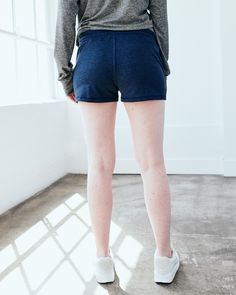 These are just about the coziest shorts you'll ever find, made from our signature Flowknit material. With a bit of stretch, they're designed to move with you - whether you're on a run, running errands, or not running at all. Our Flowknit is made from Global Recycle Standard poly yarn, which diverts and recycles plastics destined for landfill or the ocean, so you can feel and look good in what you wear.  | Quince | Women's Super Soft Performance Shorts in Navy, Flowknit Activewear, Size XS, Recyc Mid Rise Shorts, Quince, Get Up, Running Errands, The Ocean, Mid Rise, Active Wear, Couch, Yarn