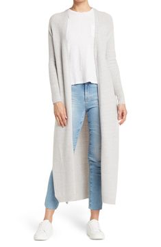 A knit duster jacket effortlessly layers over your look with it's longline fit. 49" length (size S) Open front Long sleeves Knit construction 75% acrylic, 22% nylon, 3% spandex Hand wash, dry flat Imported Model stats: 5'10" height, 32" bust, 25" waist, 36" hip. Model is wearing size S Long Gray Knit Sweater Coat, Gray Open Front Sweater Coat For Layering, Long Knit Sweater Coat For Fall, Gray Long Outerwear For Layering, Long Gray Outerwear For Layering, Long Fall Cardigan For Layering, Long Cardigan For Fall Layering, Cozy Long Spring Outerwear, Gray Long Spring Cardigan