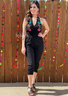 This Beautiful Halter Jumpsuit boasts a Traditional Mexican floral design combined with a modern style. The embroidered bodice with lace details combined with the halter top makes it fun and flirty. It's made out of fine Mexican cotton, has ties around the neck and elastic around the waist for an adjustable fit. This jumpsuit is handmade and hand embroidered by Mexican Artisans in Oaxaca, Mexico. It comes in one size: Small/Medium Purchase the shoes modeled here: https://www.etsy.com/es/listing/ Summer Party Jumpsuits And Rompers With Floral Embroidery, Floral Embroidered Jumpsuits And Rompers For Summer Parties, Embroidered Jumpsuits And Rompers For Summer Parties, Spring Embroidered Fitted Jumpsuits And Rompers, Embroidered Fitted Jumpsuits And Rompers For Spring, Embroidered Fitted Sleeveless Jumpsuits And Rompers, Halter Top Romper, Womens Jumpsuits, Embroidered Bodice