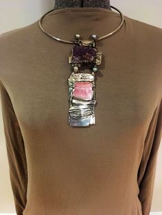 A  vintage one of a kind brutalist style very rare and unique piece of handcrafted contemporary jewelry by artist John Heller from Halifax, Mass circa 1980 Handmade of silver, amethyst geode, pearl and pink agate  John Heller was a professor of art at Bridgewater University from 1968- 2001 when he passed away. He was a sculptor, jeweler, metallurgist and potter. Many of his works remain at the University on display for all to enjoy. This is a rare statement piece and the only necklace / collar / Modern Natural Stone Pendant Jewelry, Adjustable Brutalist Jewelry Gift, Silver Choker With Natural Stones, Unique Gemstone Choker Jewelry, Silver Choker Jewelry With Natural Stones, Artisan Amethyst Jewelry, Artisan Amethyst Jewelry With Stones, Modern Amethyst Jewelry, Brutalist Pendant Jewelry Gift