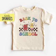 Retro Graphic Tee for Kids, Back to School with Book and Pencil T-Shirt, Cute Natural Toddler Shirt PRODUCTION TIME Little Spunkies from the designer/owner of Spunky Pineapple Co https://www.etsy.com/shop/SpunkyPineappleCo   All baby and toddler clothes are 100% designed and printed with water based ink. All orders placed before 12:00 pm EST are shipped out same day (Monday - Friday). Orders received after noon are shipped out the next business day. T-SHIRT Made from 100% Cotton. These run true Playful T-shirt For Back To School, Playful Funny Print T-shirt For School, Fun T-shirt With Text Print For Back To School, Fun T-shirt With Funny Print For Back To School, Graphic Print Tee For School Events, Graphic Tee With Graphic Print For School Events, Graphic Tee Tops For School Events, Playful Graphic Print T-shirt For Daycare, Cute Graphic Print Tops For School Events