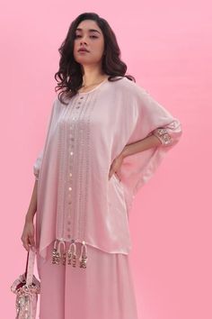 Pastel pink hand embroidered tunic featuring sequin embroidery. Paired with a coordinating flared pant. - Aza Fashions Hand Embellished Semi-stitched Kurta, Embellished Georgette Kurta For Summer, Pink Tunic Kurta For Festive Occasions, Bollywood Style Embellished Pink Palazzo Set, Pink Bollywood Style Embellished Palazzo Set, Embellished Pink Georgette Kurta, Pink Embellished Georgette Kurta, Pink Silk Embellished Kurta, Festive Pink Tunic Kurta