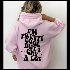 Our I'm Pretty Cool But I Cry Alot Wavy Trendy Women's Hoodie Sweatshirt is the perfect statement piece to add to your wardrobe! With a vibrant and bold design, this hoodie will make a statement wherever you go.  The wavy bubble lettering across the back of the hoodie captures the attention of anyone who sees it, while still making a statement of style and comfort. Made from a soft and comfortable cotton/poly fabric, this hoodie is perfect for lounging around in, running errands, or even wearing Trendy Graphic Print Sweatshirt For Winter, Trendy Relaxed Fit Sweatshirt, Pink Hip Hop Sweatshirt With Graphic Print, Trendy Hooded Tops With Graphic Print, Trendy Hooded Top With Graphic Print, Trendy Winter Graphic Tops, Pink Hip Hop Sweatshirt With Letter Print, Pink Hip Hop Sweatshirt For Spring, Trendy Hooded Top With Letter Print