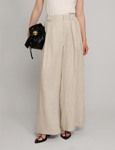 Oat linen wide leg pants . Styled with matching oversized vest . 70% tencel, 30% tencelFully lined Side pockets Back elastic waist Wide leg Size s waist is 26-27", hips 38"Size m waist is 28-29", hips 40"Model wears size S and is 5.8"/ 1.70 cmImported Baggy High Waist Linen Wide Leg Pants, Beige Baggy High-waisted Wide Leg Pants, Versatile Linen Wide Leg Summer Pants, Versatile Summer Linen Wide Leg Pants, High-waist Linen Bottoms In Neutral Color, Chic Linen Wide Leg Pants For Day Out, High Waist Linen Pants With Relaxed Fit, Spring Full-length Linen Bottoms, Wide Leg Pants With Pockets For Day Out