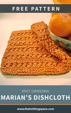 a knitted dishcloth with oranges in a bowl next to it on a table