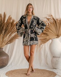 Our Short Kimono offers an easy, relaxed fit, combining comfort with understated elegance. Its fluid silhouette adds a touch of effortless charm to any outfit, making it a versatile piece for both casual days and special moments. Fitted V-neck Summer Outerwear, Fitted Kimono For Spring Loungewear, Fitted V-neck Outerwear For Day Out, Versatile Fitted V-neck Outerwear, Elegant Fitted Summer Kimono, Chic Black V-neck Kimono, Versatile V-neck Summer Outerwear, Chic Summer Outerwear For Night Out, Elegant Long Sleeve Relaxed Fit Kimono